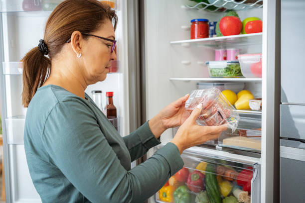 Labelled meal prep containers in a refrigerator